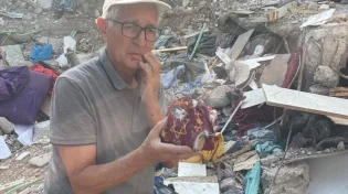 המתנה של הרצוג לביידן: החנוכייה והתפילין ששרדו את התופת
