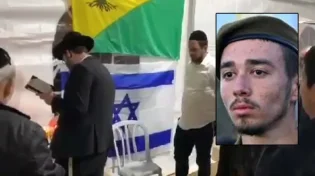 המתנדבים החרדים בהדלקת נר חנוכה בבית החייל שנפל